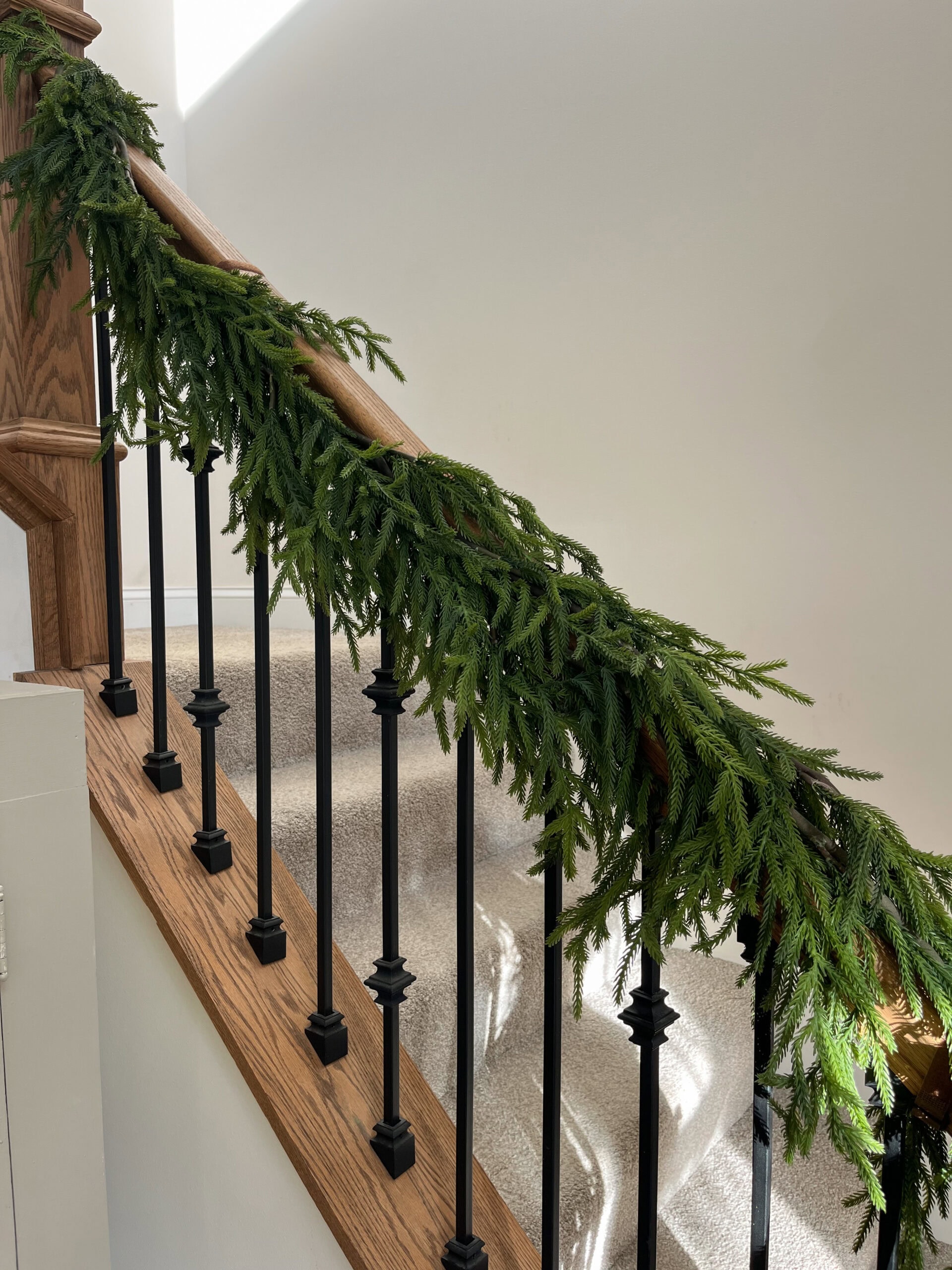 winter garland on stair railing